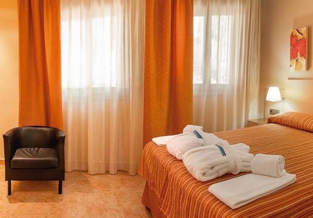 Románticas habitaciones en Confluent Health Resort. Disfrúta con nuestro Spa y Masaje en Valencia